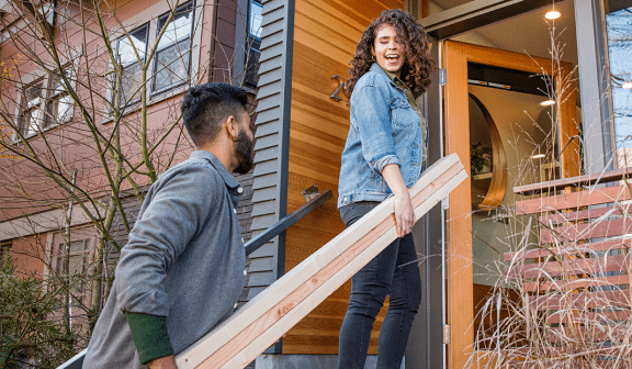 Couple working on house