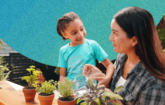 Mother and daughter tending to plants.