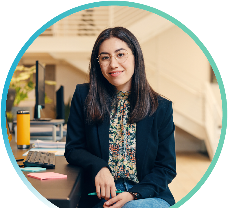 Woman sitting at their desk in an office.