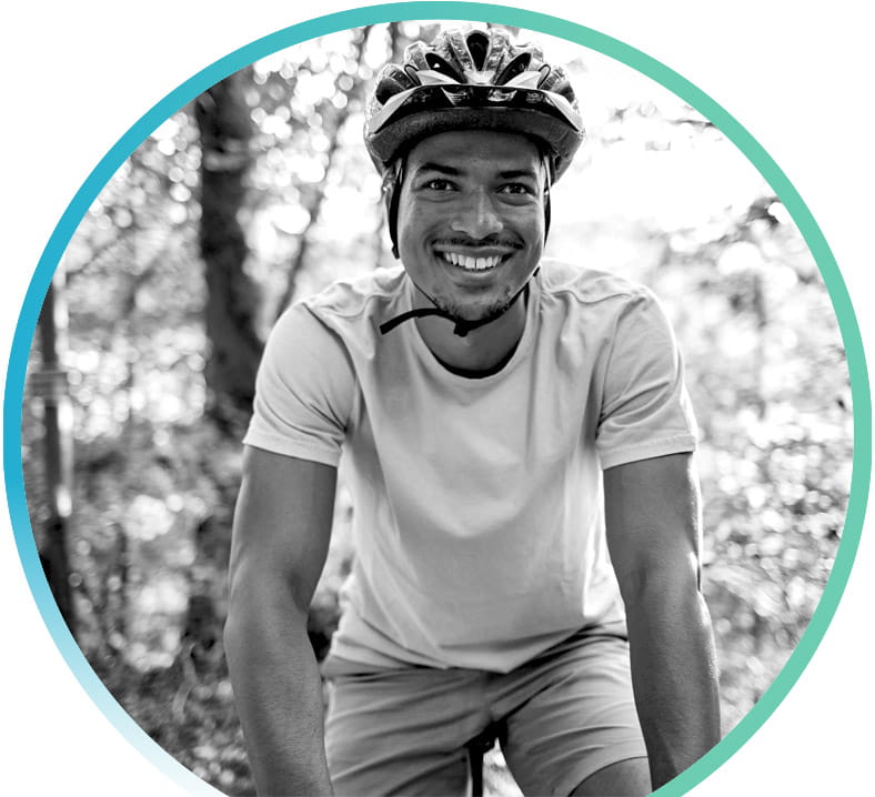 Guy wearing a helmet while riding a bike