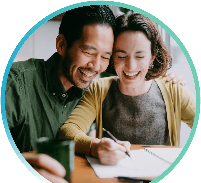 Couple working on a journal together.