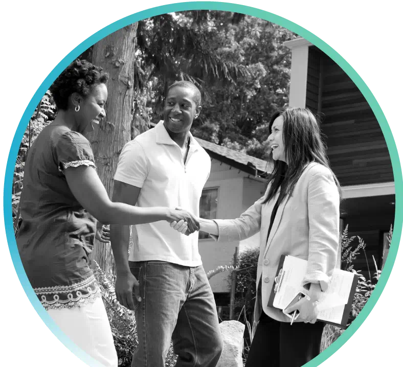 Couple shaking hands with realtor