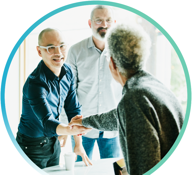 Two men speaking with an agent about professional liability insurance.