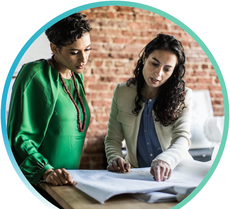 Two women reviewing building concepts.