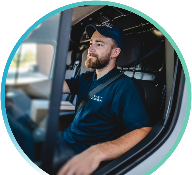 Delivery driver behind the wheel of a vehicle.