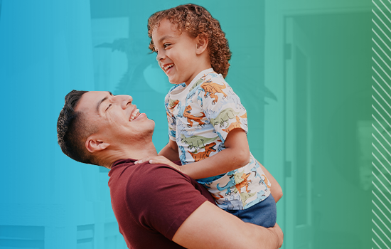 Father holding his child up.