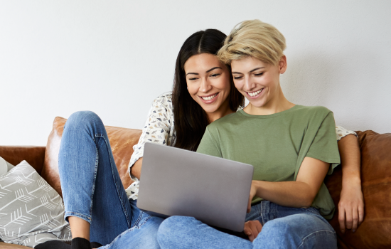 Couple sitting together on the couch in their home living room