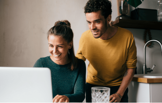 Man and a woman working on their laptop