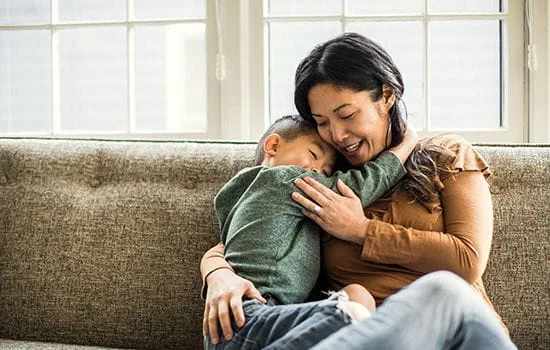 Woman on couch with child